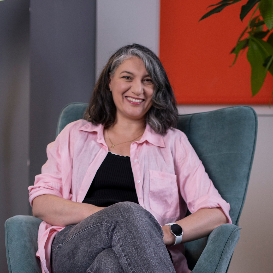 Karen in a chair smiling