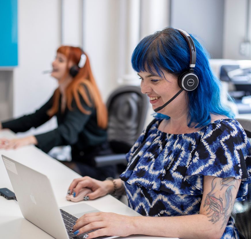 Two customer support reps with head sets