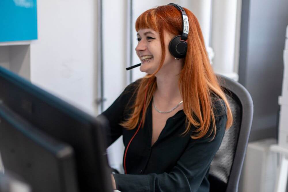 Woman with headset smiling