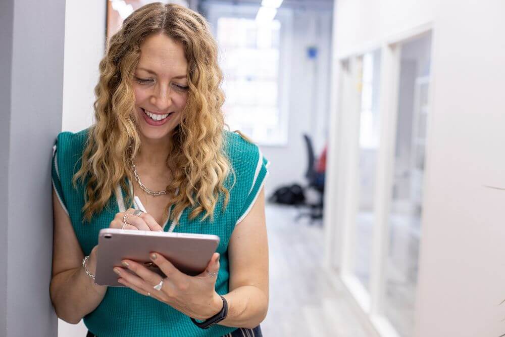 Woman signing on an ipad